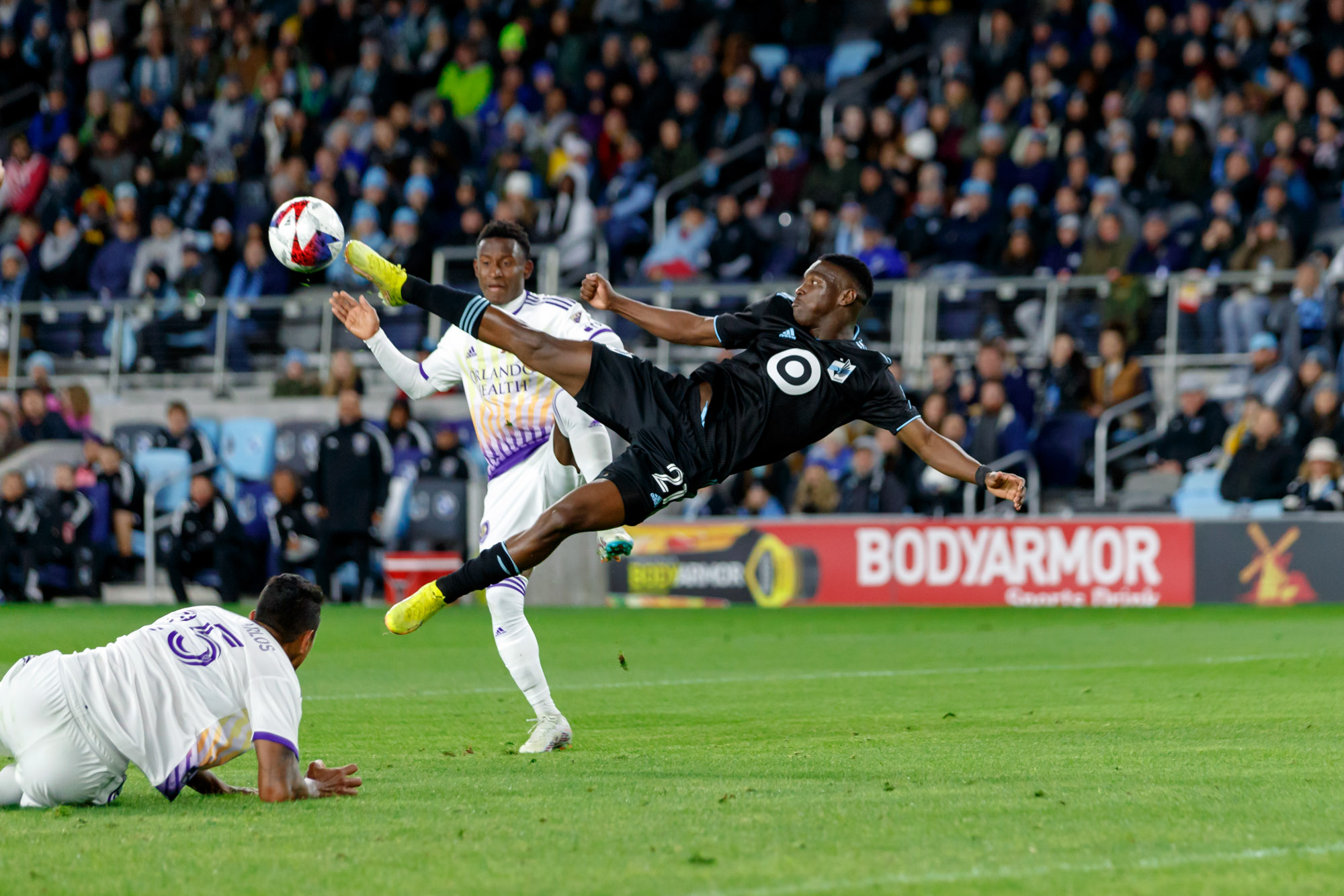 Bongokuhle Hlongwane stretches out with both feet off the ground.